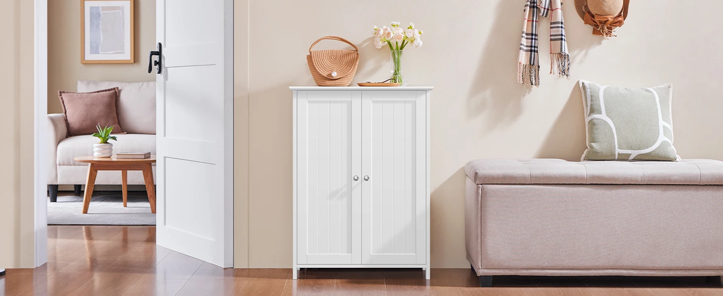 Freestanding bathroom floor cabinet beside toilet