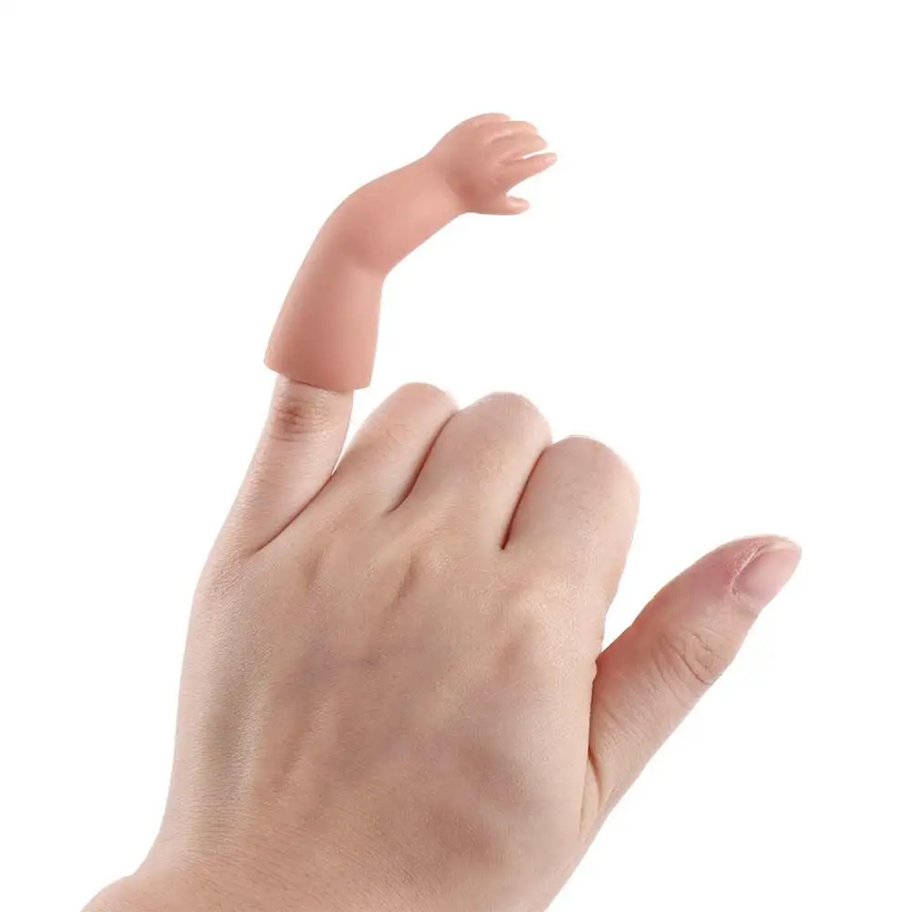 Miniature hand shown in mid-trick with a coin