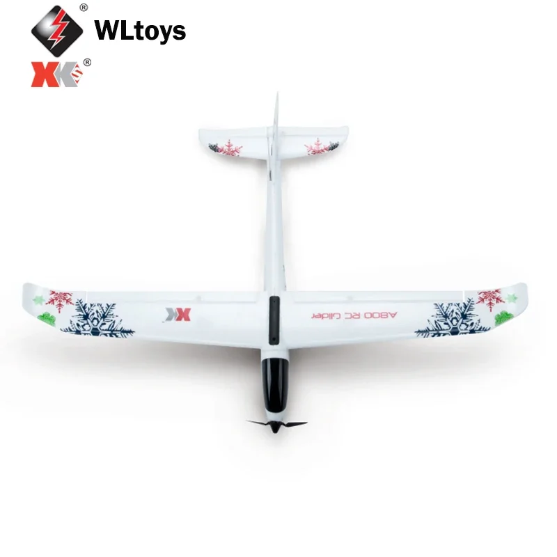 WLtoys A800 Sky King Planeur RC Blanc posé sur l'herbe, prêt pour un vol de 20 minutes