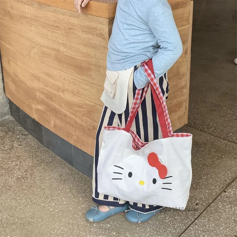 Sanrio 헬로 키티 패션 토트 백 여성의 새로운 트렌드 대용량 핸드백 하라주쿠 단순 캐주얼 통근 캔버스 숄더 백