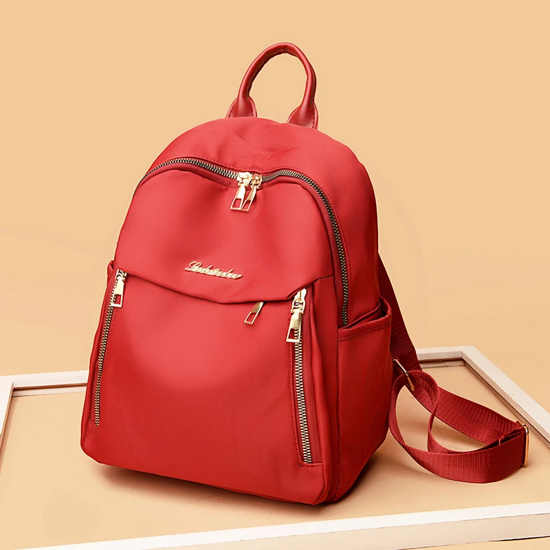 1 women's travel backpack, large capacity Oxford cloth nylon backpack, with adjustable shoulder straps, black color, zipper clos