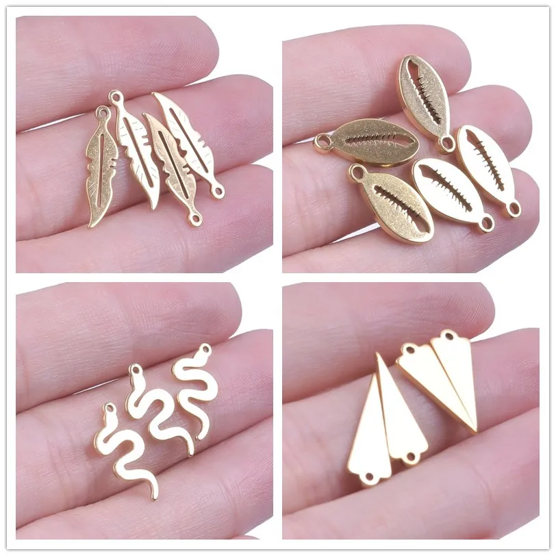 

20pcs/Lot Leaves Feather Charms Stainless Steel Shell Snake Triangle Crown ET Musical Note Pendant For Jewelry Making Necklace