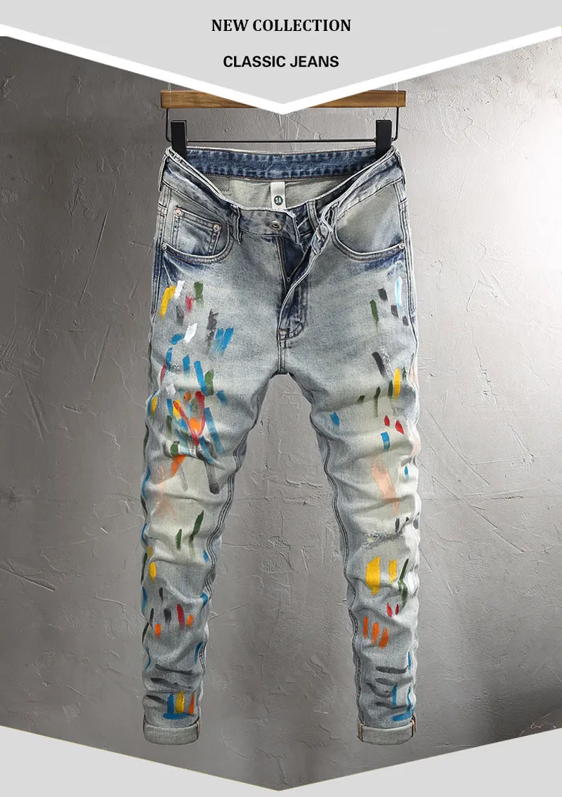 Front view of Drayven Edgewave Paint Splatter Distressed Jeans on hanger