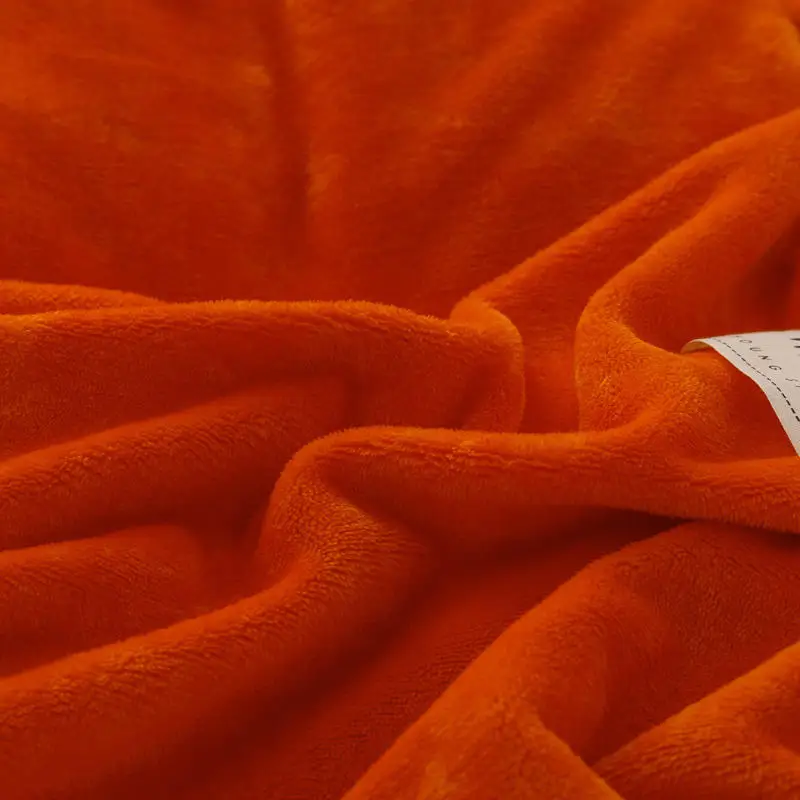 macia e grossa, cor laranja, cobertor quente