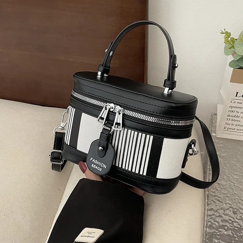 

Exquisite small bucket bag with European and American contrasting vertical stripes stylish handheld crossbody makeup box bag