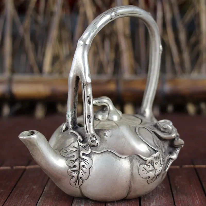

Collectible Old Decorated Handwork Tibet Silver Carved Frog On Pumpkin Tea Pot Mascot Teapot Flagon Statues for Decoration