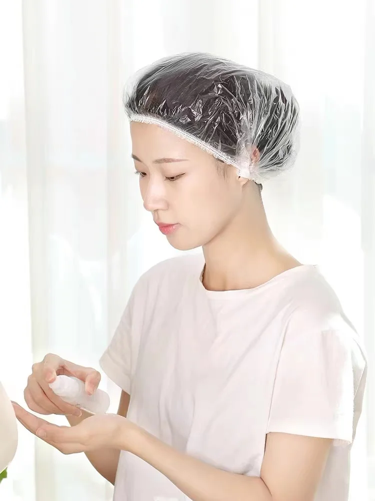 

100 Pieces Disposable Plastic Shower Caps Waterproof Head Covers Hotel Hair Dye Clear Shower Caps for Beauty Salons.