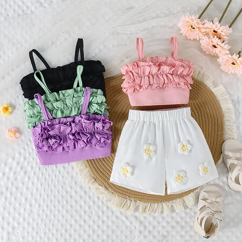 

2024-05-07 Lioraitiin Baby Girls Summer Outfits Cute Sleeveless Ruffle Tops + Crochet Flower Shorts Set Toddler 2Pcs Clothes