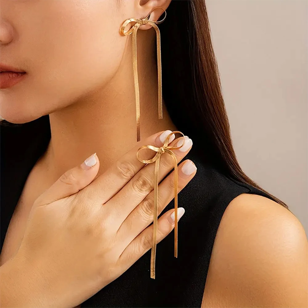 2316040-f58172.jpg Sb3d6728e6e1b41f89e2e435cf2ff4be4E New Fashion Gold Color stainless steel Flat Snake Chain Knot Bow Earrings for Women Bowknot Long Tassel Earring Jewelry Mallzona