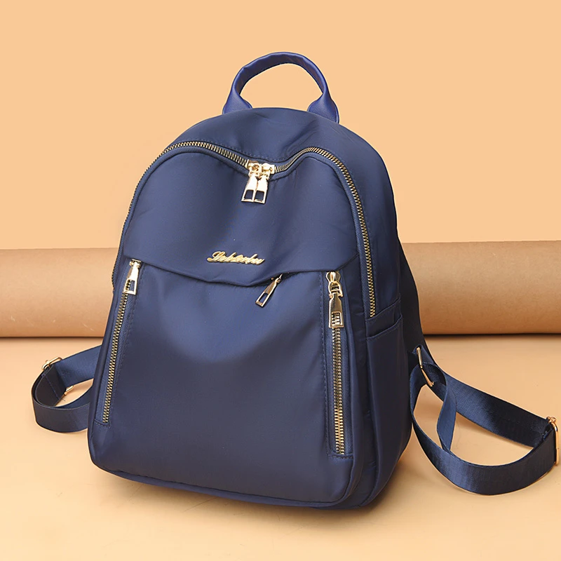 1 women's travel backpack, large capacity Oxford cloth nylon backpack, with adjustable shoulder straps, black color, zipper clos