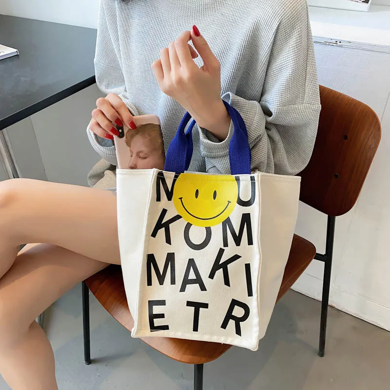 2022 Canvas bag New Summer Korean Japanese Cartoon Canvas Smile Handbag Large Capacity Shoulder Bag Hit Color Letter Female Tote 