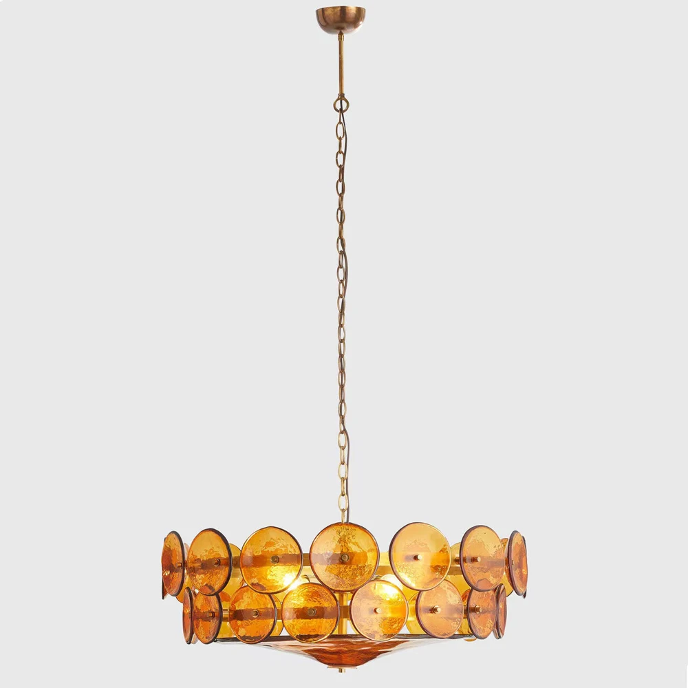The Italian Retro Pendant Light features a circular mid-century design with amber glass discs and a bronze frame, suspended by a chain, highlighting timeless Italian artisan lighting.
