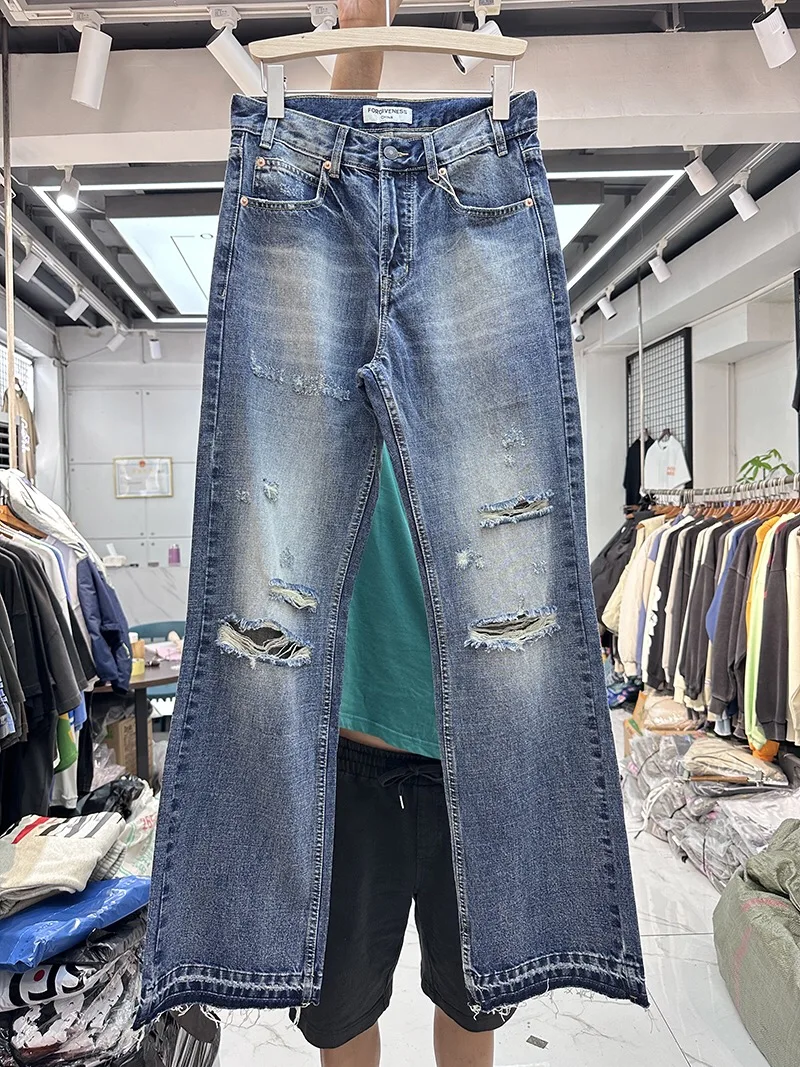 

Water-washed ripped fringed jeans casual pants