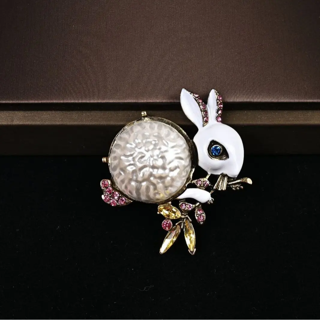 

Vintage pearl drop oil colored diamond rabbit brooch