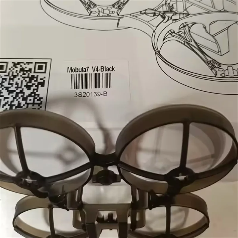 Vue de dessus du cadre 75mm pour Moblite7 Mobula7 Happymodel blanc transparent montrant les bras et le centre.