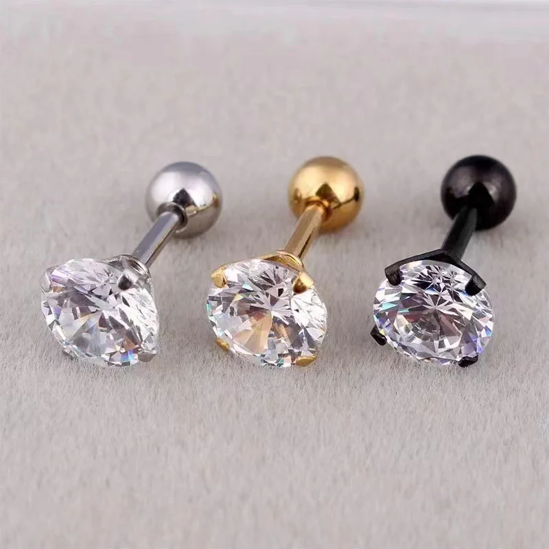 Gold-tone geometric crystal stud earrings on display