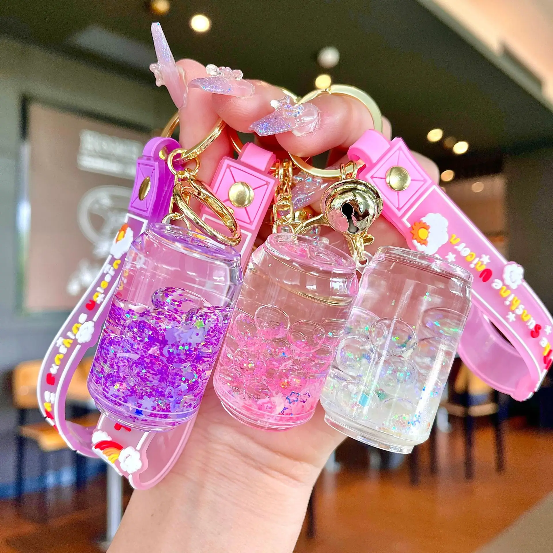 https://ae01.alicdn.com/kf/Sb557a412c91b4038be71fb0972c9d76an/Cute-Liquid-Oil-Keychain-Cartoon-Cup-Drink-Bottle-Acrylic-Hanging-Ornament-Bag-Key-Pendant-Floating-Quicksand.jpg