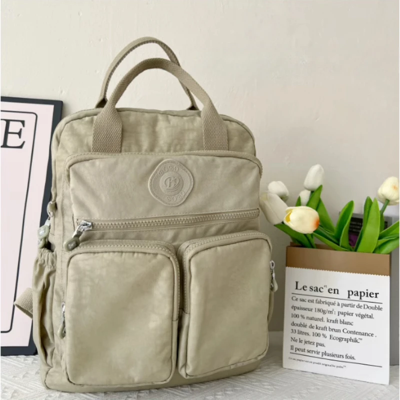 حقيبة ظهر نسائية متعددة الجيوب، تتميز بمقبض علوي ن...