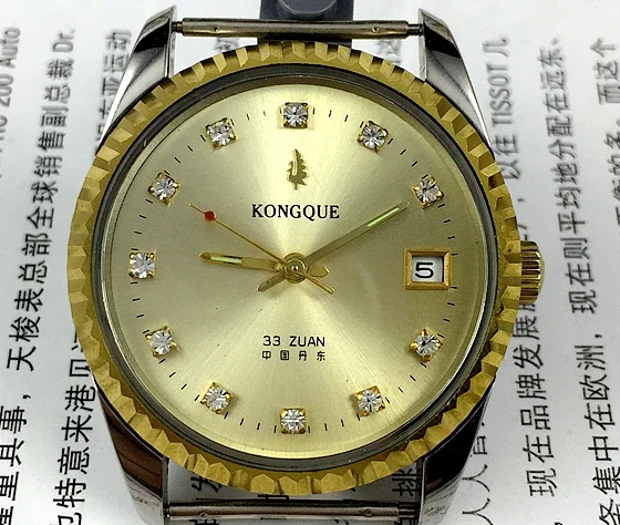

Original Peacock brand white steel yellow diamond scale single calendar fully automatic mechanical watch with a diameter of 37mm