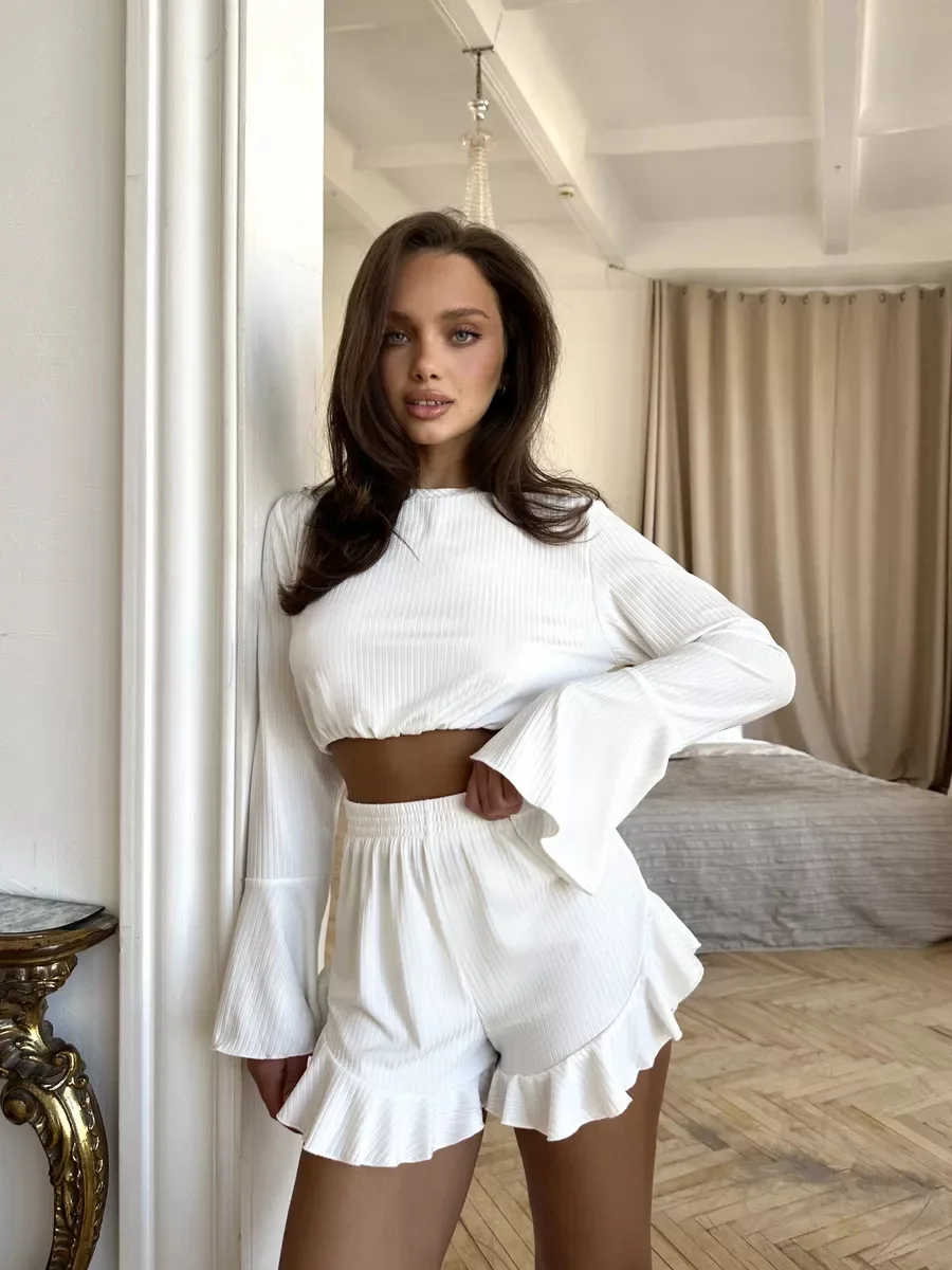 Long sleeve pajama set with round neck top, matching frill shorts, and relaxed lounge fit
