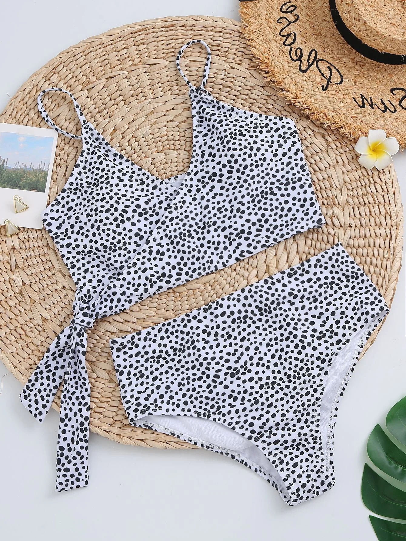 Women's green polka dot bikini swimsuit top view