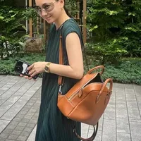 FIRMRANCH Minimalist Design Korean Niche Brand Large Capacity Top Layer Cowhide Lychee Pattern Soft Commuting Backpack For Women 1