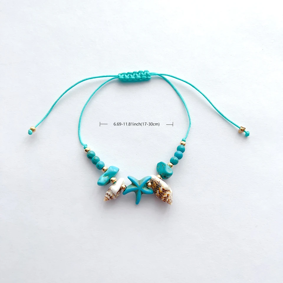 Bracciale rigido stelle marine conchiglie blu strass