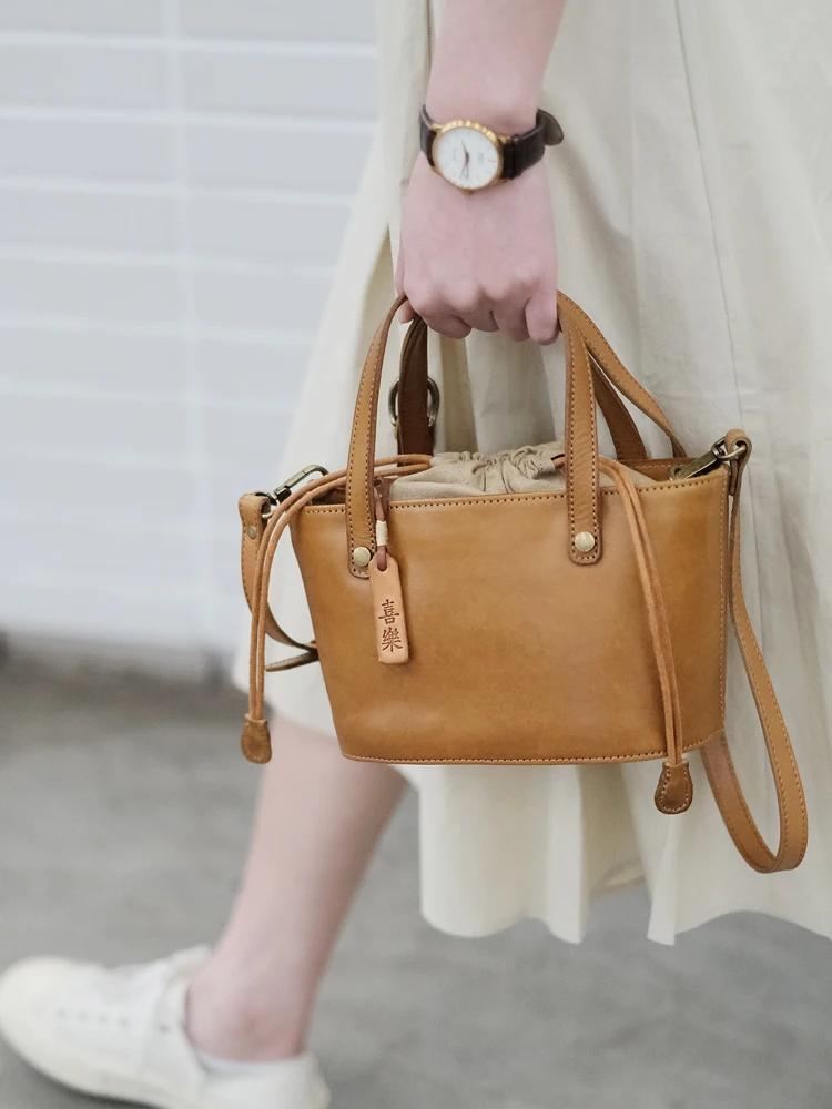New Drawstring Retro Portable Bucket Bag Women's Leather High-end Sense Niche Large-capacity Soft Leather Commuter Messenger Bag