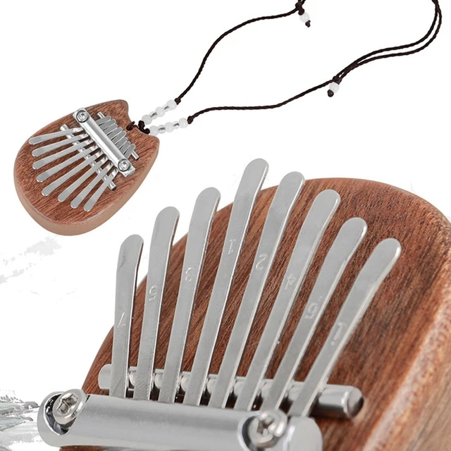 Enchanting sound of the 8 Keys Mini Owl Kalimba Thumb Piano