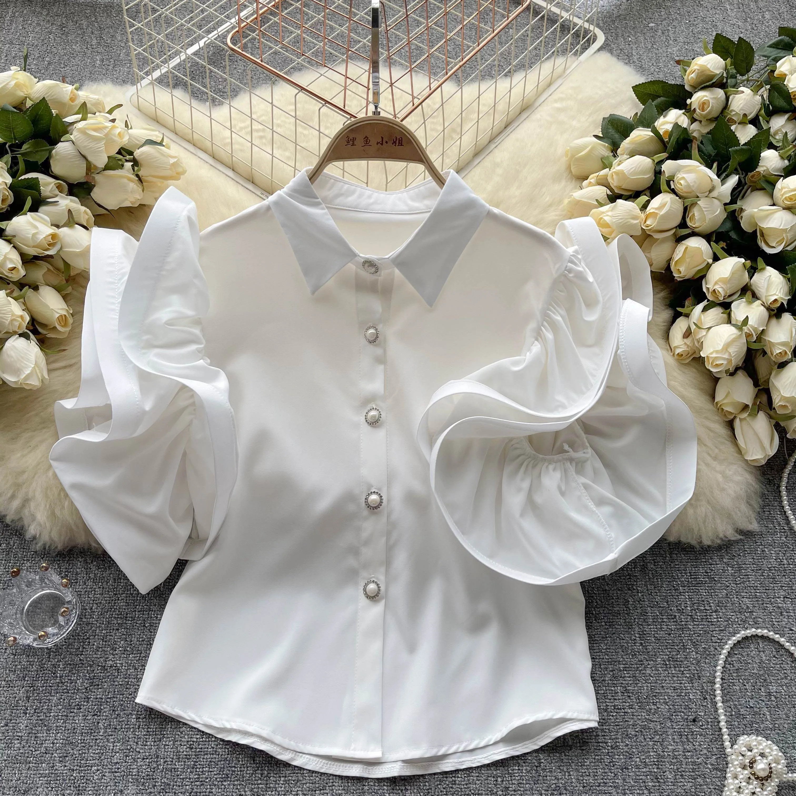 white shirt with frill sleeves