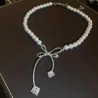 Collier avec nœud en perles et strass pour femmes, mode légère, Niche de luxe, chaîne de clavicule, nouvelle personnalité, bijoux de fête 1