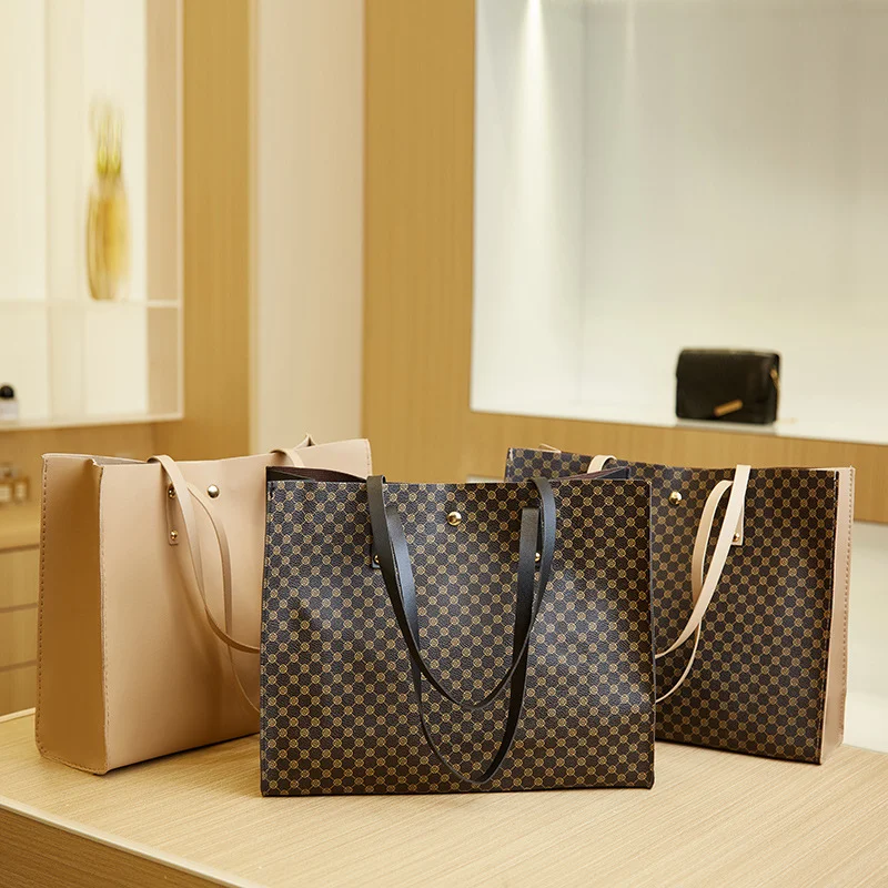 Goyard Saint Louis vs. Louis Vuitton Neverfull: Battle of the Totes