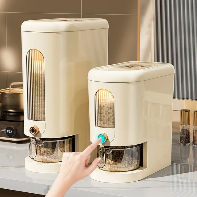 Sorty automatic rice dispenser in milky-white on a kitchen counter, with the measuring cup placed underneath the spout.
