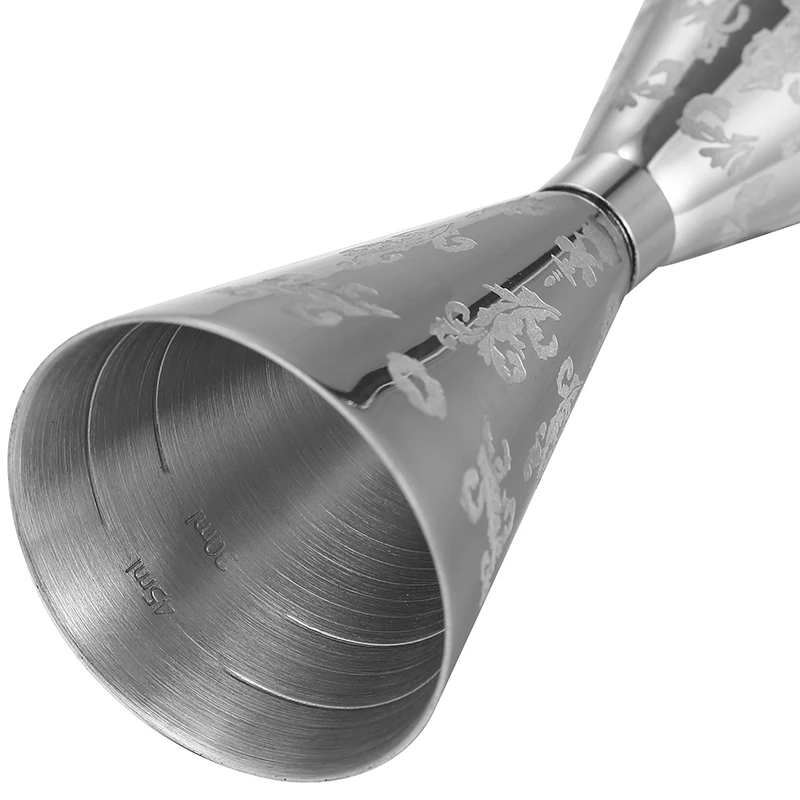 Assorted stainless steel cocktail jiggers for precise drink measurement in different sizes and finishes