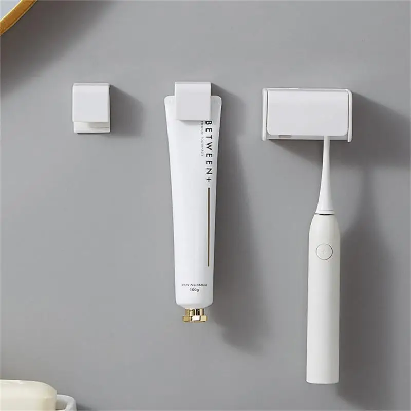 

Wall-mounted Toothbrush Holder Self Adhesive Toothpaste Holder Facial Cleanser Clip Toothbrush Storage Rack Bathroom Accessories
