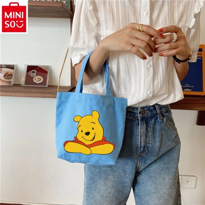 MINISO Disney Fashion Canvas Bag Handbag Women's Cartoon Winnie Bear Print Makeup Storage Sweet and Fresh Portable Handbag