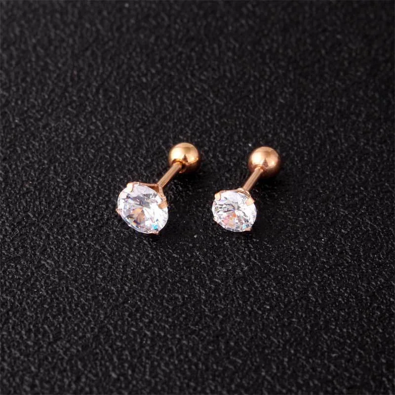 Model wearing geometric crystal stud earrings