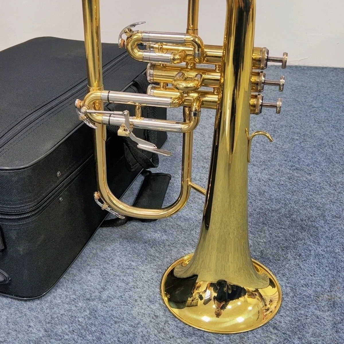 

Flugelhorn B-flat lacquered gold brass American craft manufacture trumpet brass instrument specializing in high-end performance