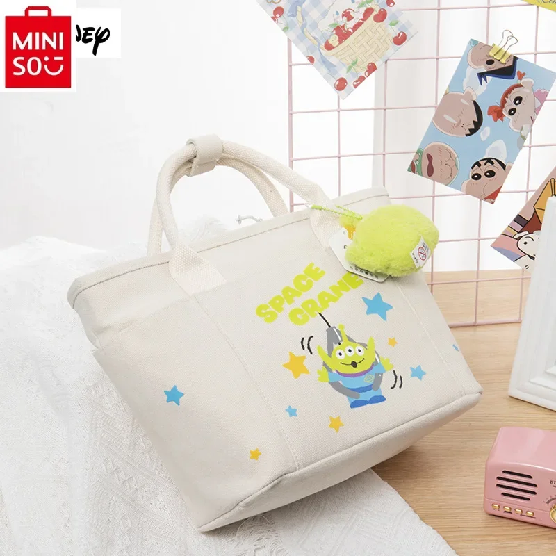 MINISO Disney cartoon three eyed pendant cute handbag women's fashionable high-quality canvas carrying crossbody bag