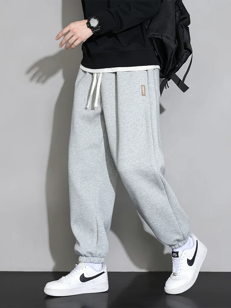 Men's loose fit sports sweatpants with ruched detailing.
