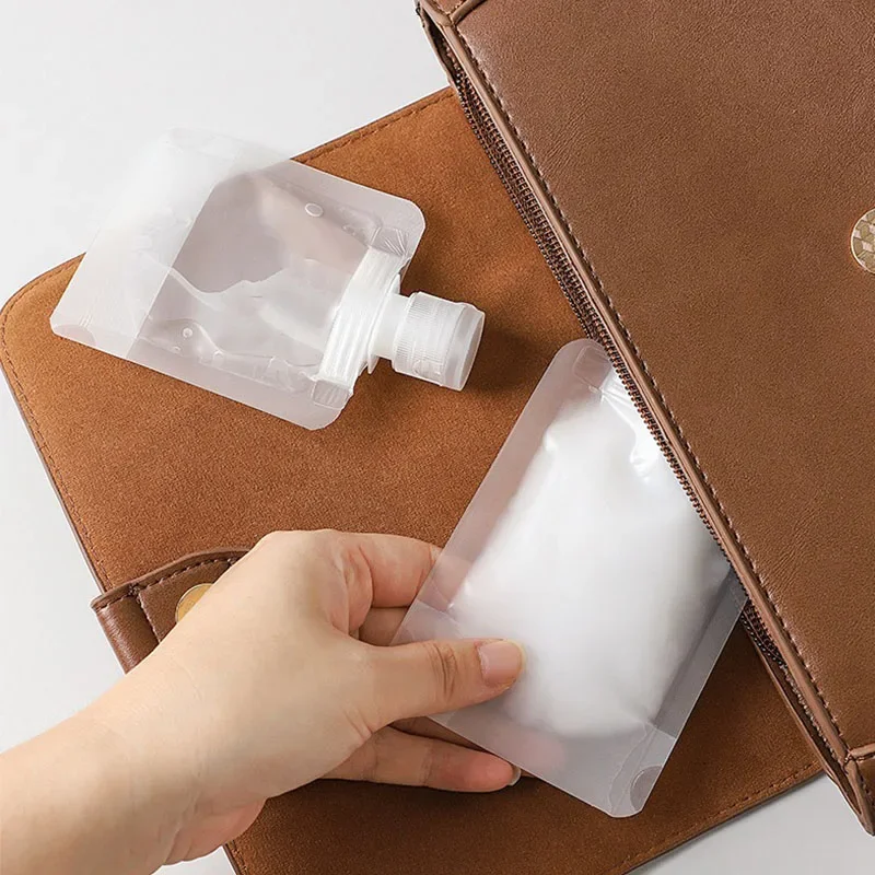 Set of 5 Refillable Travel Cosmetic Bottles and Pouches - Assorted Sizes