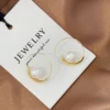 86957-e5779b.jpg Boucles d'oreilles françaises avec perles artificielles circulaires simples, Niche, Style haut de gamme, boucles d'oreilles polyvalentes