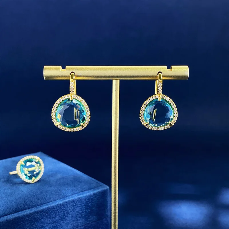 Crystal blue transparent gemstone style triangular earrings