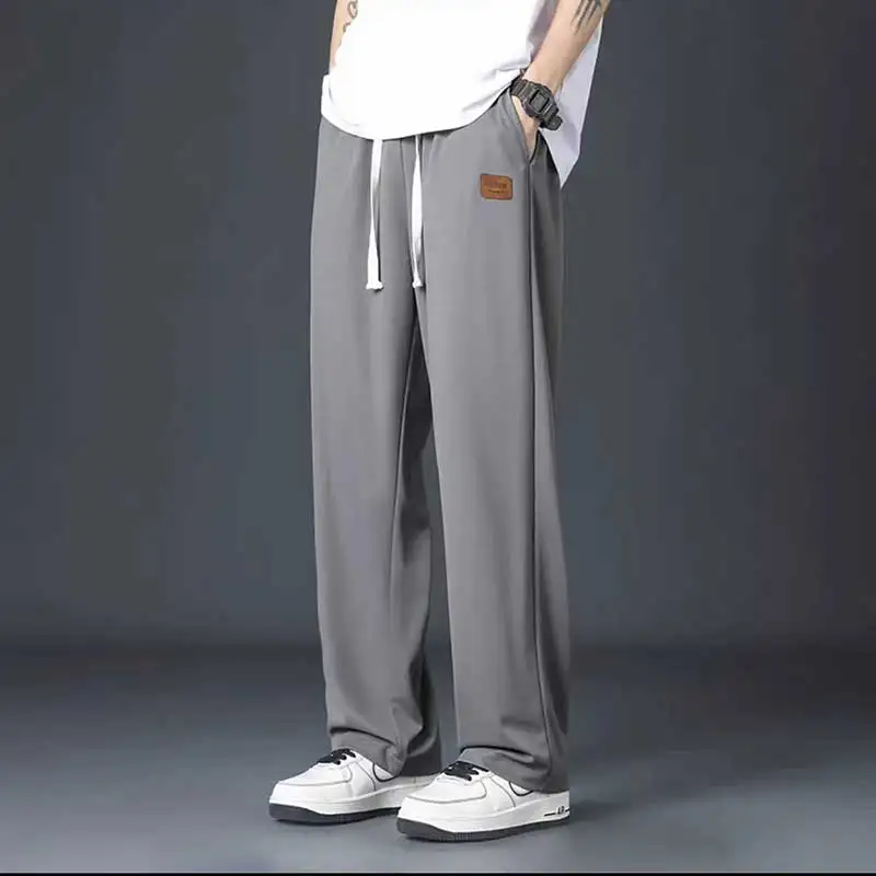 Pantalones de primavera y otoño para hombre, pantalón holgado, deportivo, versátil e informal, de gran tamaño, tendencia, nuevo estilo, 2024