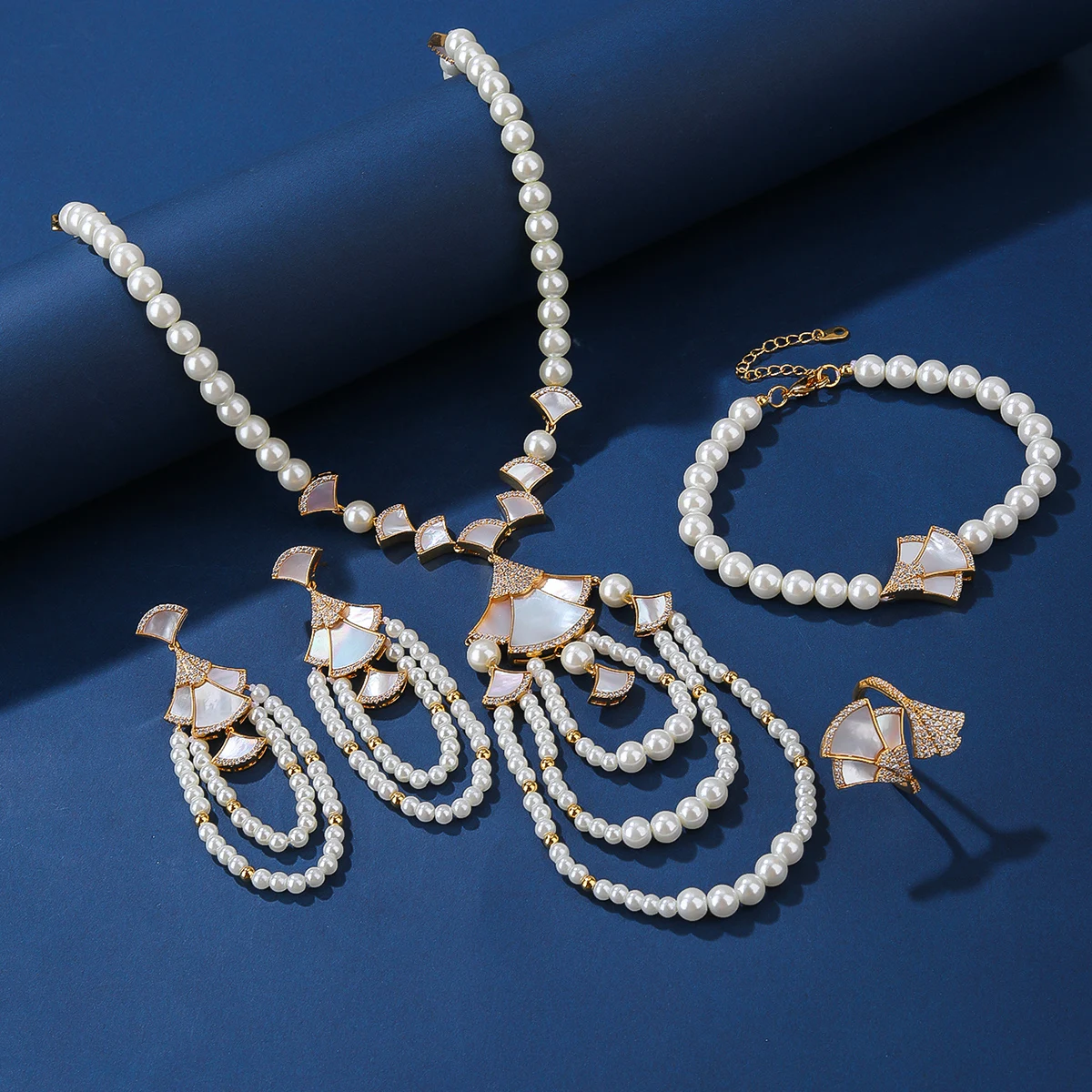 Exquisite Pearl Jewelry Set: Necklace, Earrings, Bracelet & Ring. Featuring lustrous pearls, elegant shell inlays & delicate gol
