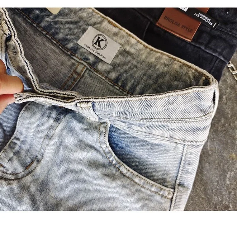Korean version of westernized high waisted double breasted torn denim shorts for women's fashionable belly tightening, non