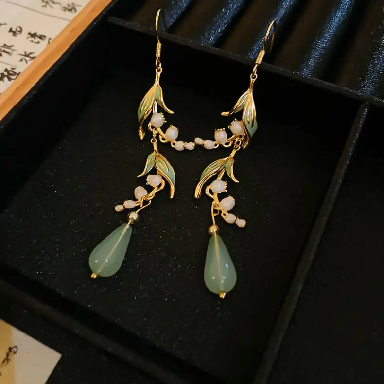 Sb905c155d85049fca0261ab650239f69U Elegant White Orchid Flower Earring for Women Ladies Temperament Metal Leaves Long Tassel Drop Earrings Hook Jewelry Accessories Mallzona