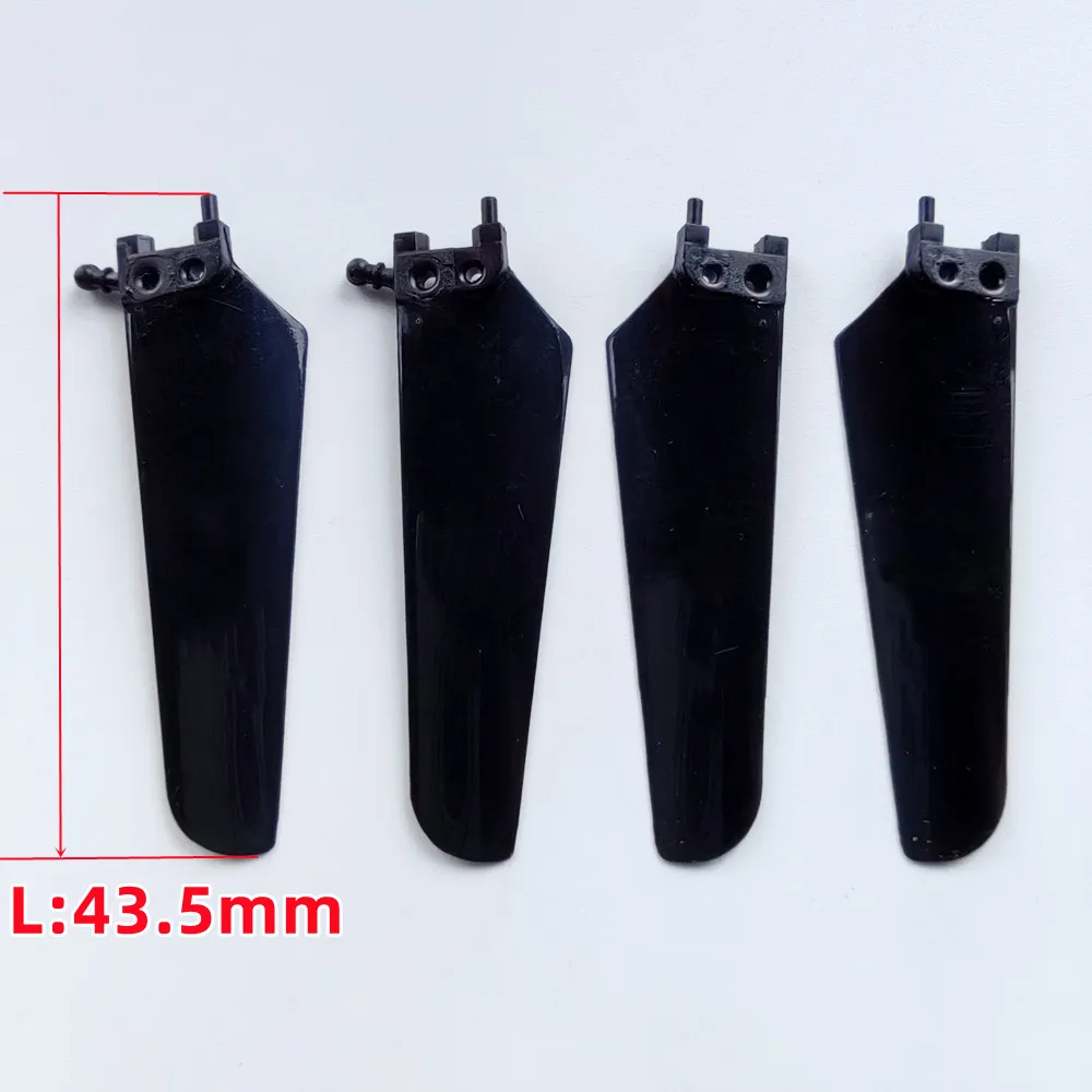 Pales de rechange pour hélicoptère RC, détail de la fixation et du matériau composite.