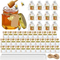 Mini Honey Jars Party Favors  Hexagon Small Glass Honey Jars with Dipper, Gold Lids, Cute Bee Pendants, Gift Bags and Jute 1