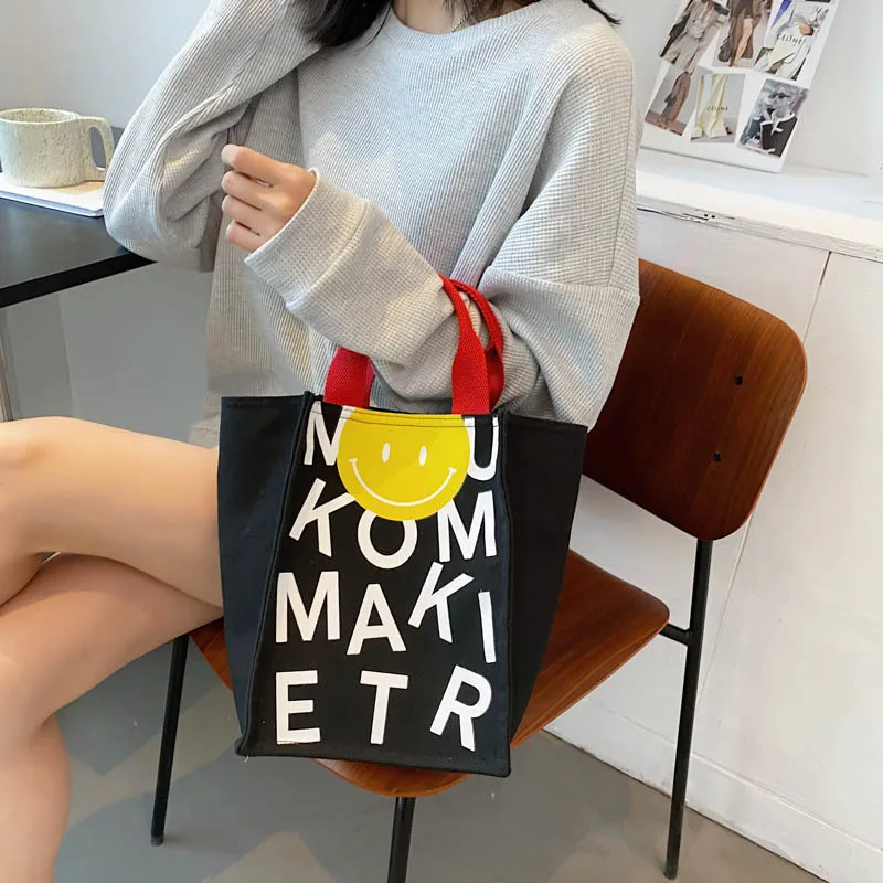 2022 Canvas bag New Summer Korean Japanese Cartoon Canvas Smile Handbag Large Capacity Shoulder Bag Hit Color Letter Female Tote 